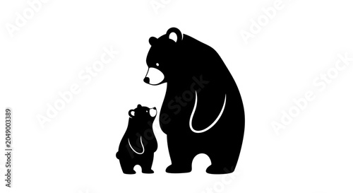 Obraz na plátně Mother bear and cub standing together in silhouette