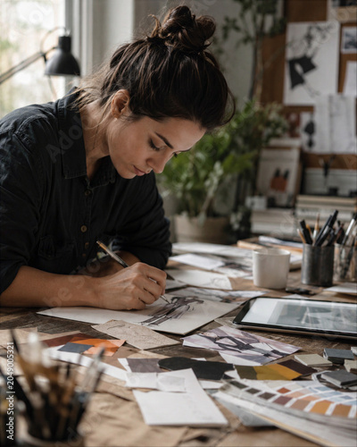 Freelance Designer Sketching at Messy Creative Desk