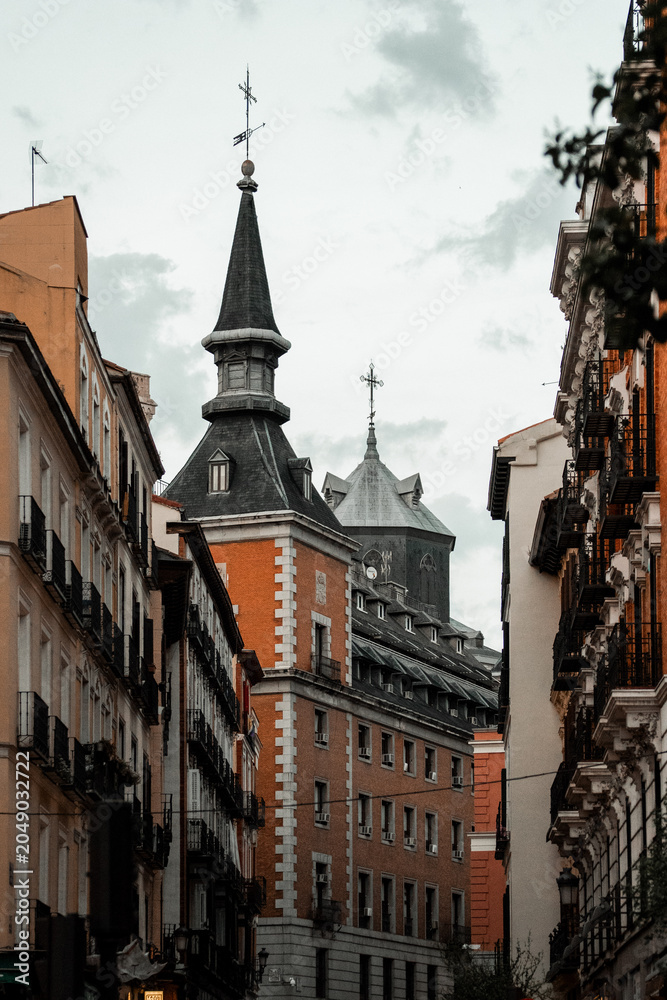 Obraz premium Architecture of the city center of Madrid, Spain. Alley and narrow roads with Spanish balconies and design.