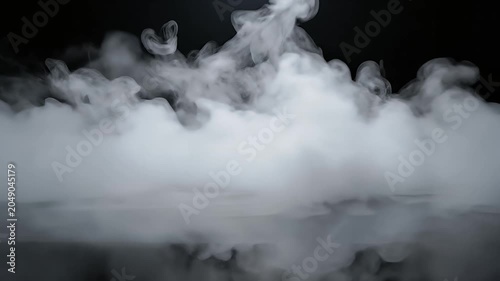 White smoke swirling on black reflective surface