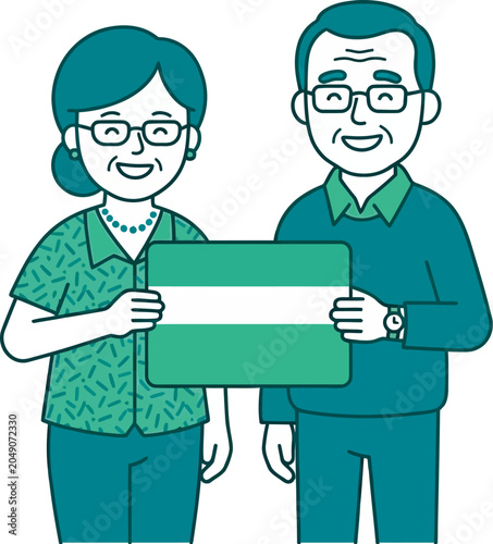 Senior couple smiling while holding a green insurance benefit card.
