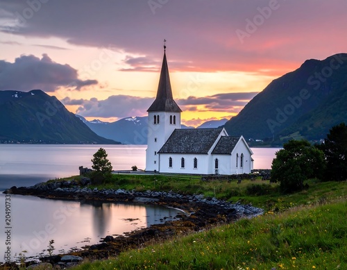 Serene church, scenic fjord, mountains, sunset, long exposure