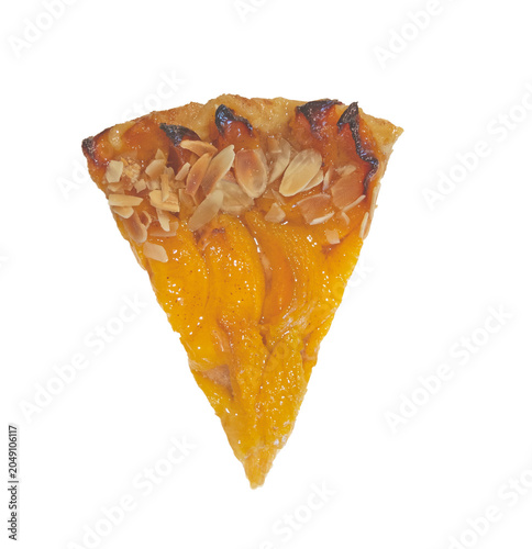 Piece of freshly baked Peach tart on a white background