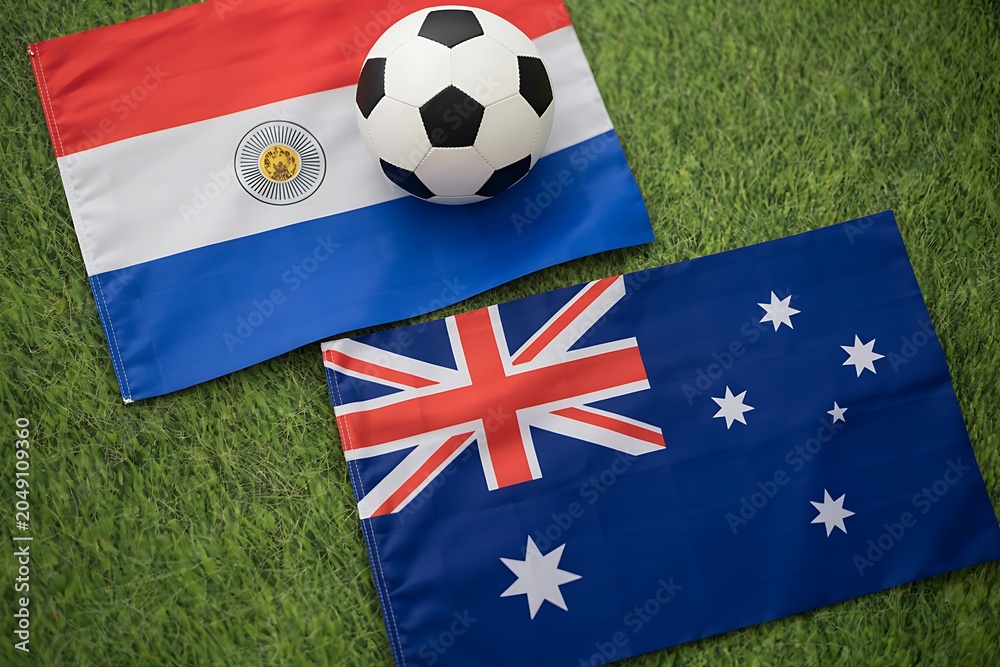 Fototapeta premium Argentina and australia flags with soccer ball on green field