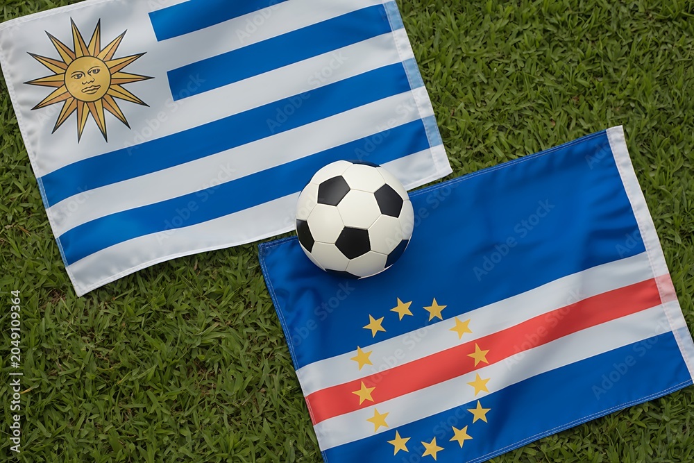Naklejka premium Uruguay and cape verde flags with soccer ball on green grass