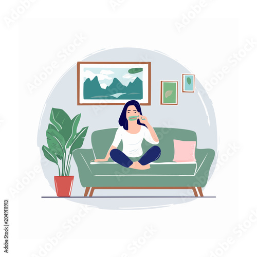 Woman relaxing on a sofa in a living room