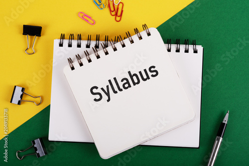 Syllabus text on notepad and stationary