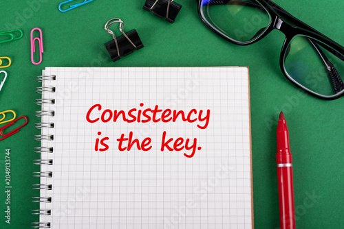 Notepad with quote Consistency is the Key