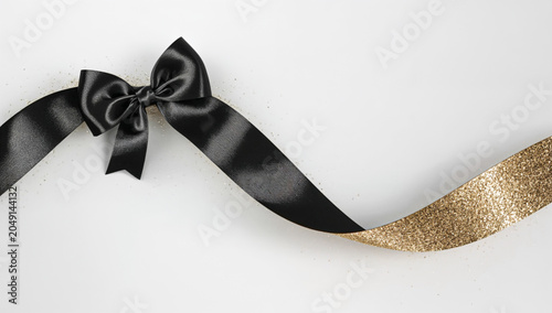 premium black friday marketing banner template with isolated silk bow and elegant gold glitter accents, realistic product presentation layout with copy space on soft white background, high-conversion 
