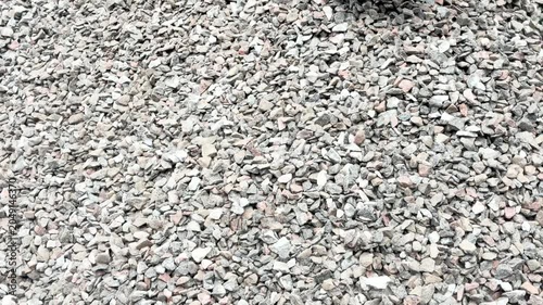 Truck unload crushed rocks. Dump truck unloads crushed stone from the body