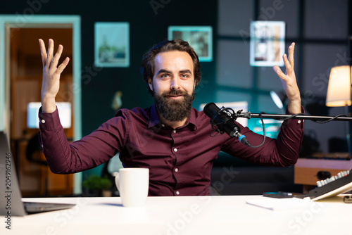 Schilderij op canvas Joyful internet star shooting video, doing frantic gesturing in studio