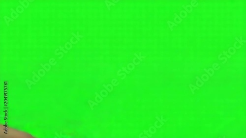 Closeup of two people shaking hands against a green screen background, symbolizing partnership, agreement, and professional cooperation in a business setting 4k video