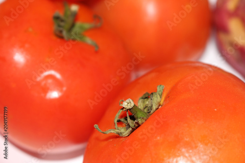 Fresh red tomatoes group. Ripe vegetables bunch on table. Organic tomatoes close up. tomatoes with selective focus. set of tomatoes with blurs