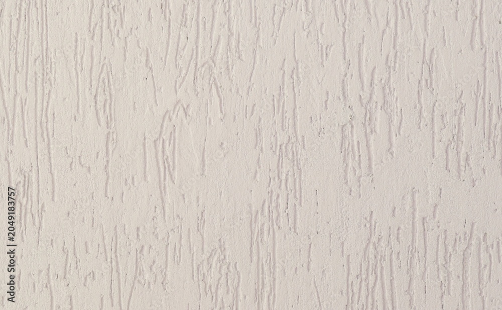 Fototapeta premium Decorative stucco wall background texture pattern. Light peach color wall