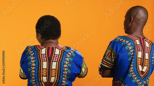 Foto Back view of african american people stopping each other from talking, being frustrated and angry