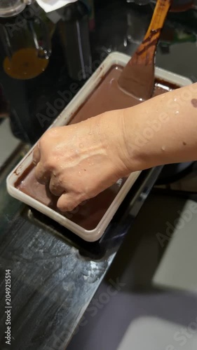 stir the chocolate cake mixture and coconut milk liquid in a cake bowl