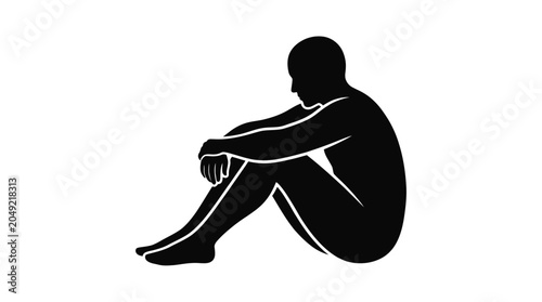A silhouette of a person sitting with knees drawn up and head bowed.