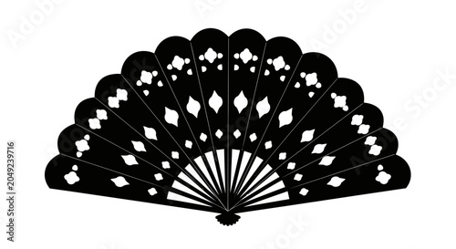 A black decorative folding hand fan with intricate cutout patterns.