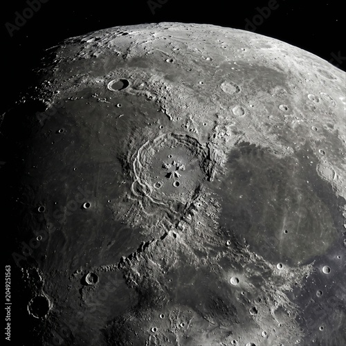 Detailed lunar surface showing craters and terrain. High resolution image of the moon showing craters and lunar landscape