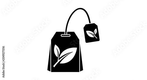 Black tea bag with leaf design.