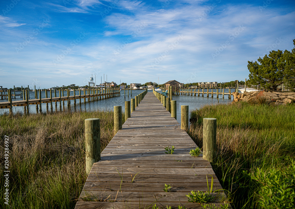 Fototapeta premium Pier on silver lake Ocracoke Island NC