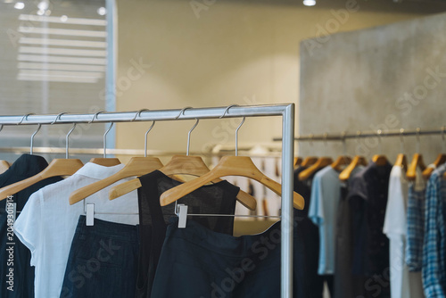 Bild auf Leinwand Fashionable female clothes in a boutique store stock