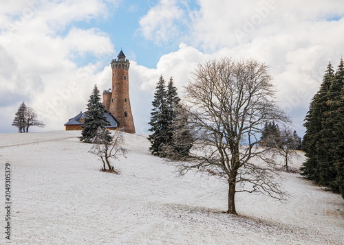 Fichtelberg tower standing on snowy mountain landscape in winter