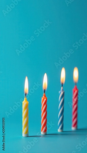 Five lit birthday candles on a vibrant blue background , blue, pastel, detail