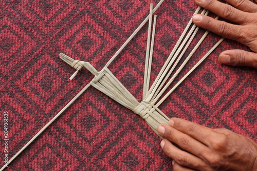 The process of making suket puppets, which are made from a type of grass called mendong