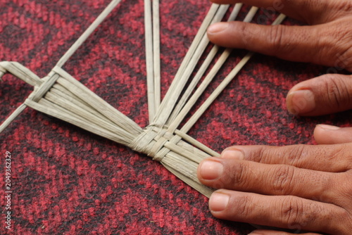 The process of making suket puppets, which are made from a type of grass called mendong