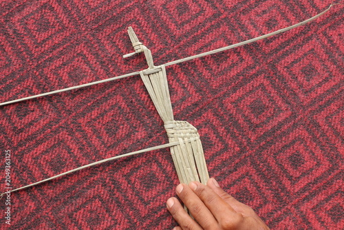 The process of making suket puppets, which are made from a type of grass called mendong