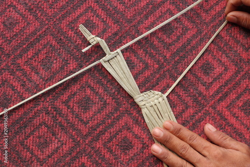 The process of making suket puppets, which are made from a type of grass called mendong