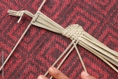 The process of making suket puppets, which are made from a type of grass called mendong