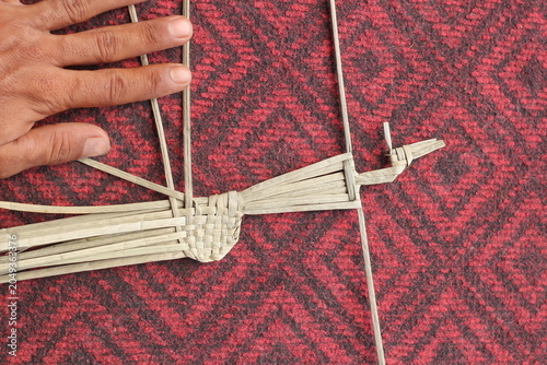 The process of making suket puppets, which are made from a type of grass called mendong