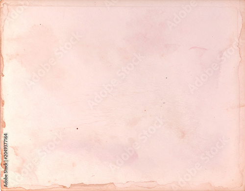 ヴィンテージ風の淡いピンクの紙テクスチャ背景。レトロな質感のアンティークな背景素材。/Vintage pale pink paper texture background. Antique background material with a retro texture.