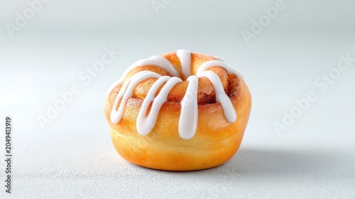 Delicious Cinnamon Roll with Icing on a Light Background