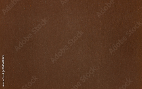 Dark brown paper texture with fine fibers and a subtle vertical pattern. Elegant natural background for designs, packaging and graphic resources.