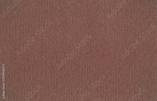 Brown corrugated paper texture with fine vertical lines and a uniform finish. Background ideal for packaging, graphic design and craft projects.