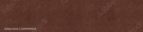 Dark brown corrugated paper texture with fine vertical lines and a uniform finish. Ideal background for packaging, graphic design and craft projects.