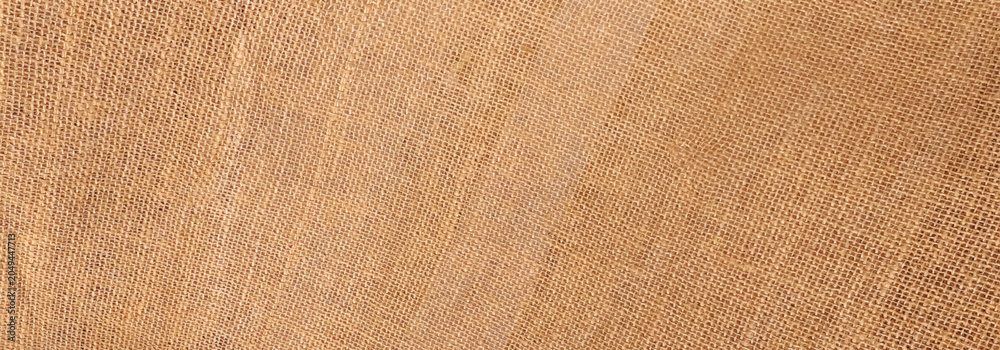 Fototapeta premium Brown sackcloth jute background.