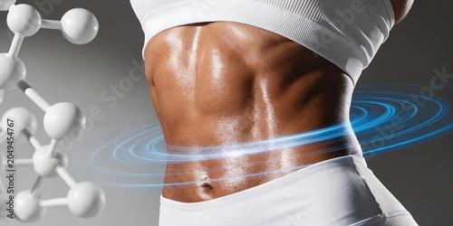 Close-up of a toned and fit female abdomen with a glowing blue circular graphic overlay, representing health and wellness