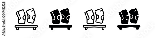 Foto Four icons of sports shin guards on a stand