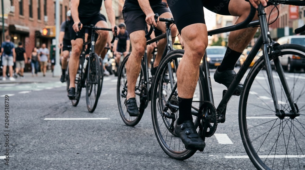 Fototapeta premium Cyclists Pedaling on Road Bike in City Traffic, Urban Fitness Lifestyle made by AI generative