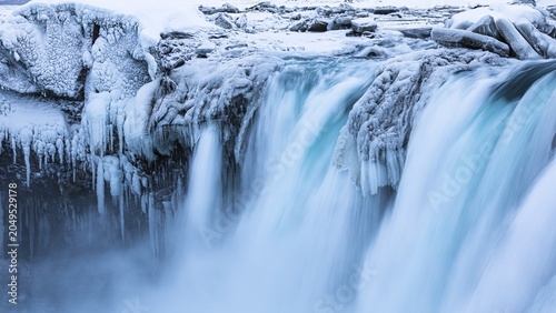 Godafoss waterfall, icy and snowy rock face, Northern Iceland Eyestra, Iceland