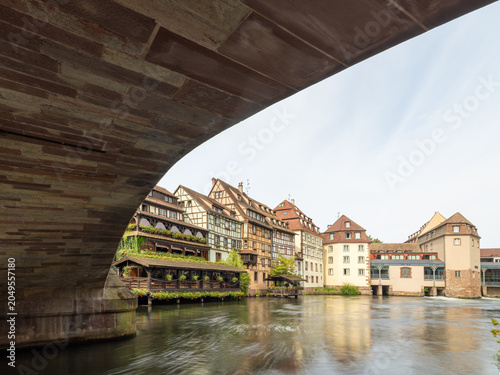 View beneath historic bridge over canal in Strasbourg old town