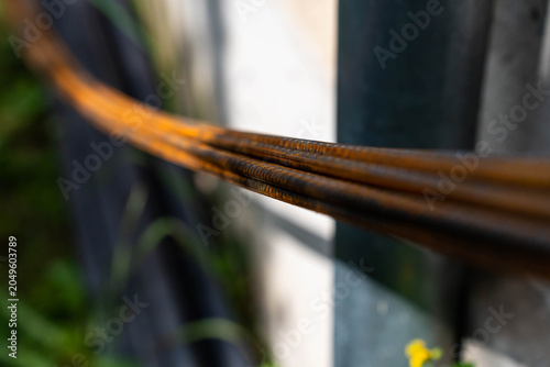 Rusty group of iron construction bars, rods , shallow depth of field, space for text.
