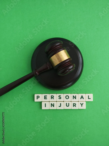 Gavel and personal injury words symbolizing legal proceedings and compensation claims
