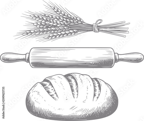 Vintage baking wheat, rolling pin, and loaf of bread