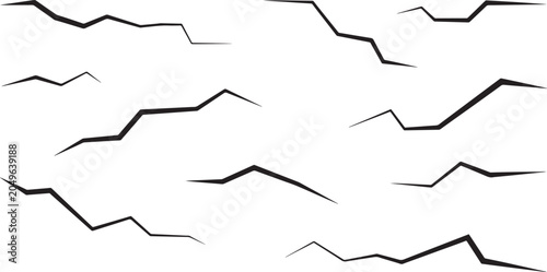 Scattered jagged black cracking line shapes
