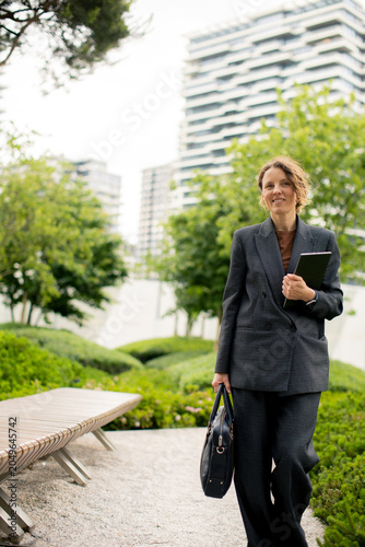 Businesswoman walks through...